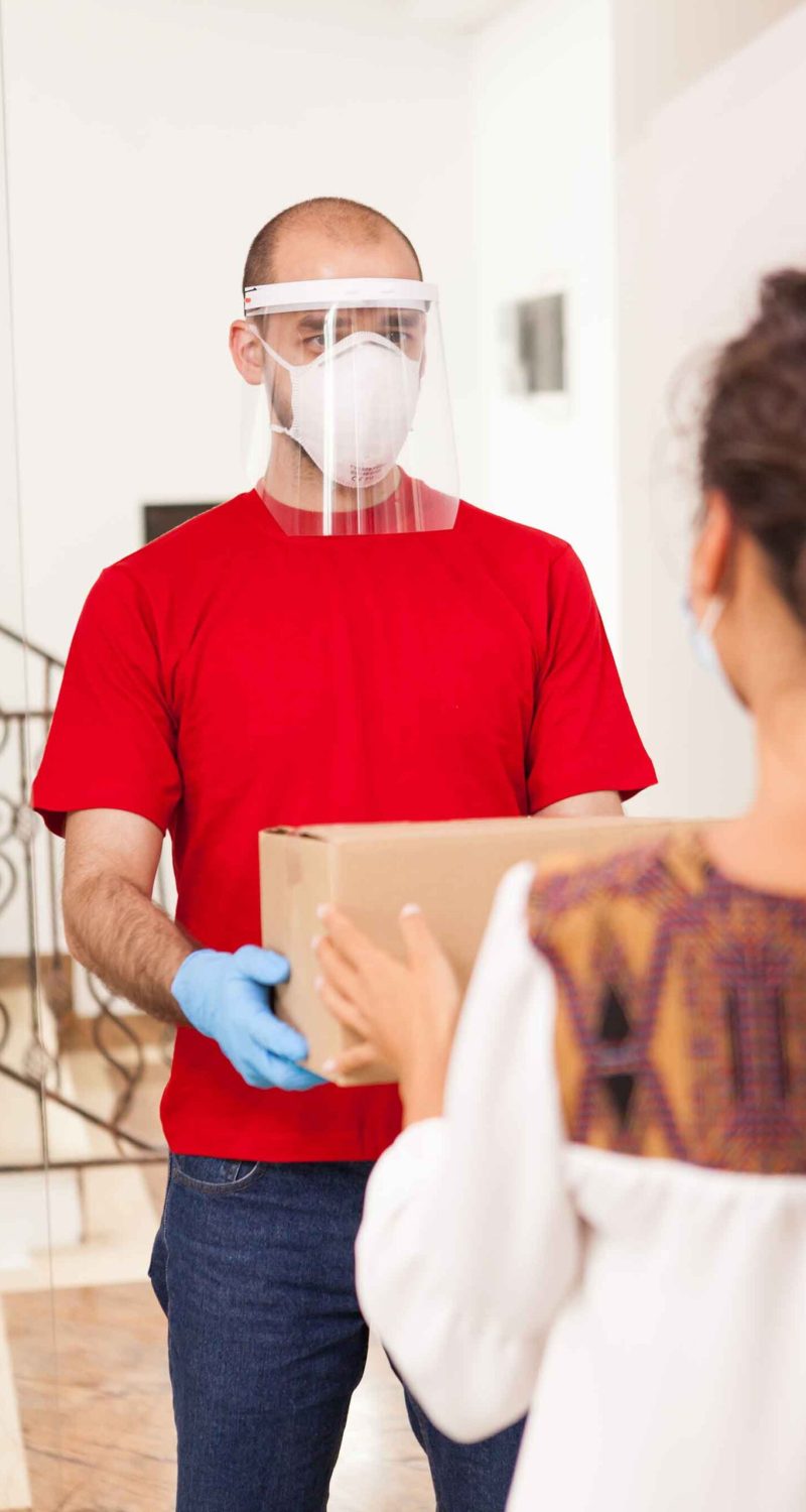 deliveryman-wearing-protection-mask-2DMKM9K.jpg